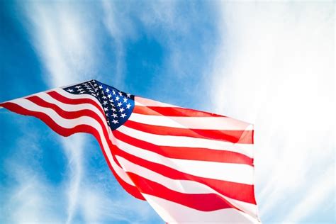 Close Up United States Of America Flag On The Blue Sky Background Usa Close Up United States Of America Flag On The Blue Sky Background Usa