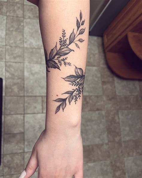 Delicate Floral Vine Tattoo