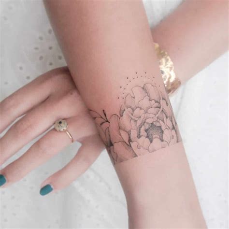 Elegant Flower Wrist Tattoo Ideas For A Delicate Look
