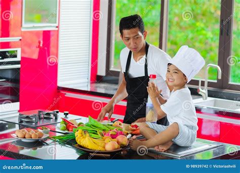 Private Thai Chef Cooking His Little Son In Chef S Hat Nearby S Stock Private Thai Chef Cooking His Little Son In Chef S Hat Nearby S Stock