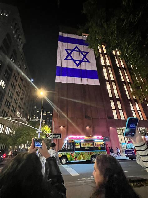 Tisch Family Members Project Faces Of Israeli Hostages On Nyu Building Tisch Family Members Project Faces Of Israeli Hostages On Nyu Building